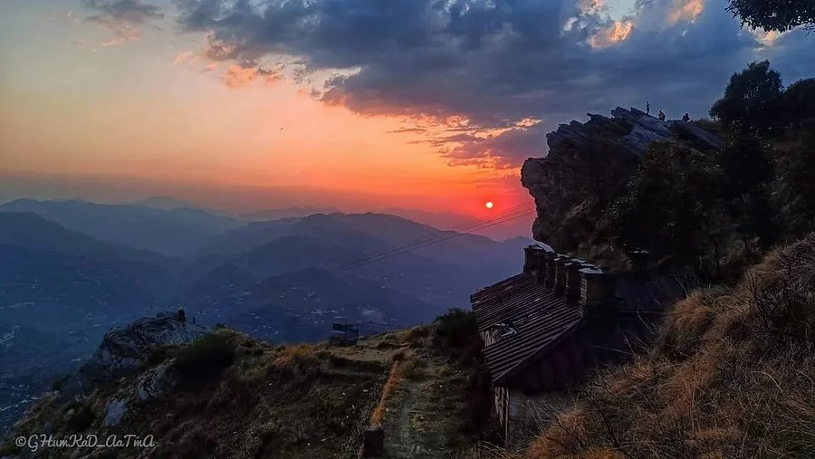 View of the deep valley from Chauli Ki Jali cliff, a popular tourist attraction for sunsets in Mukteshwar