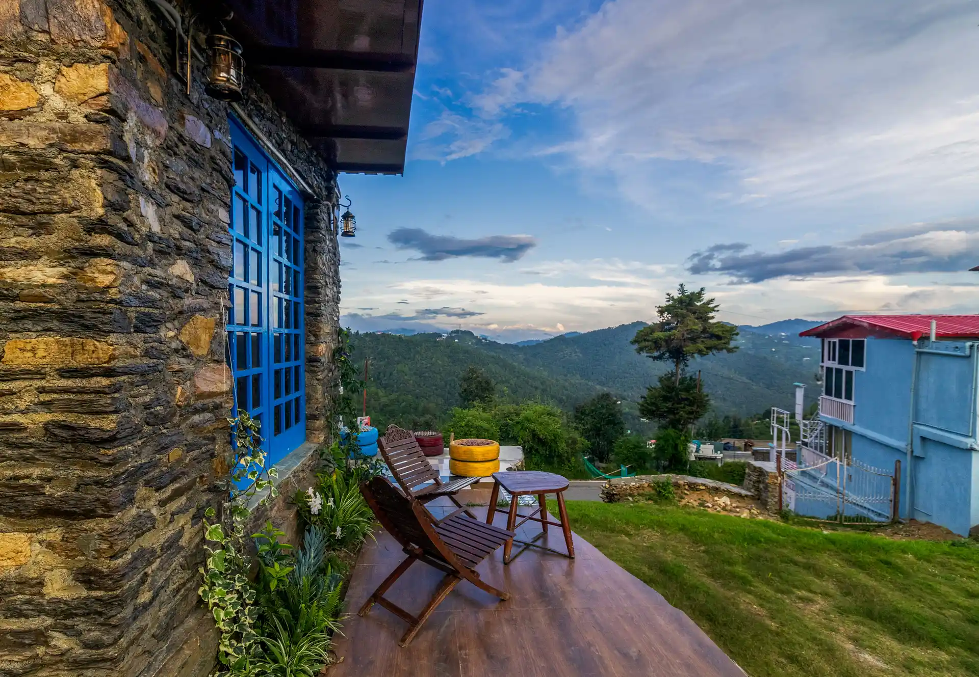 Outdoor terrace at Stone Heritage offering stunning sunset views over the Himalayas