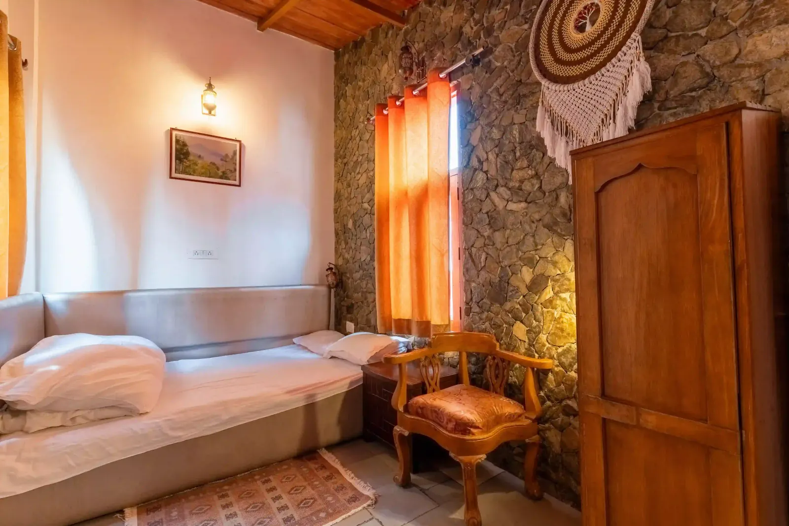 Cozy Cedar Room interior with wooden paneling and modern amenities at Stone Heritage